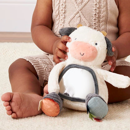Itzy Ritzy Sensory Tummy Time Toy Mirror - Features Crinkle & Jingle Sounds, Multiple Textures and Mirror for Self-Discovery, Infant Toy for Ages 0 Months and Up, Cow