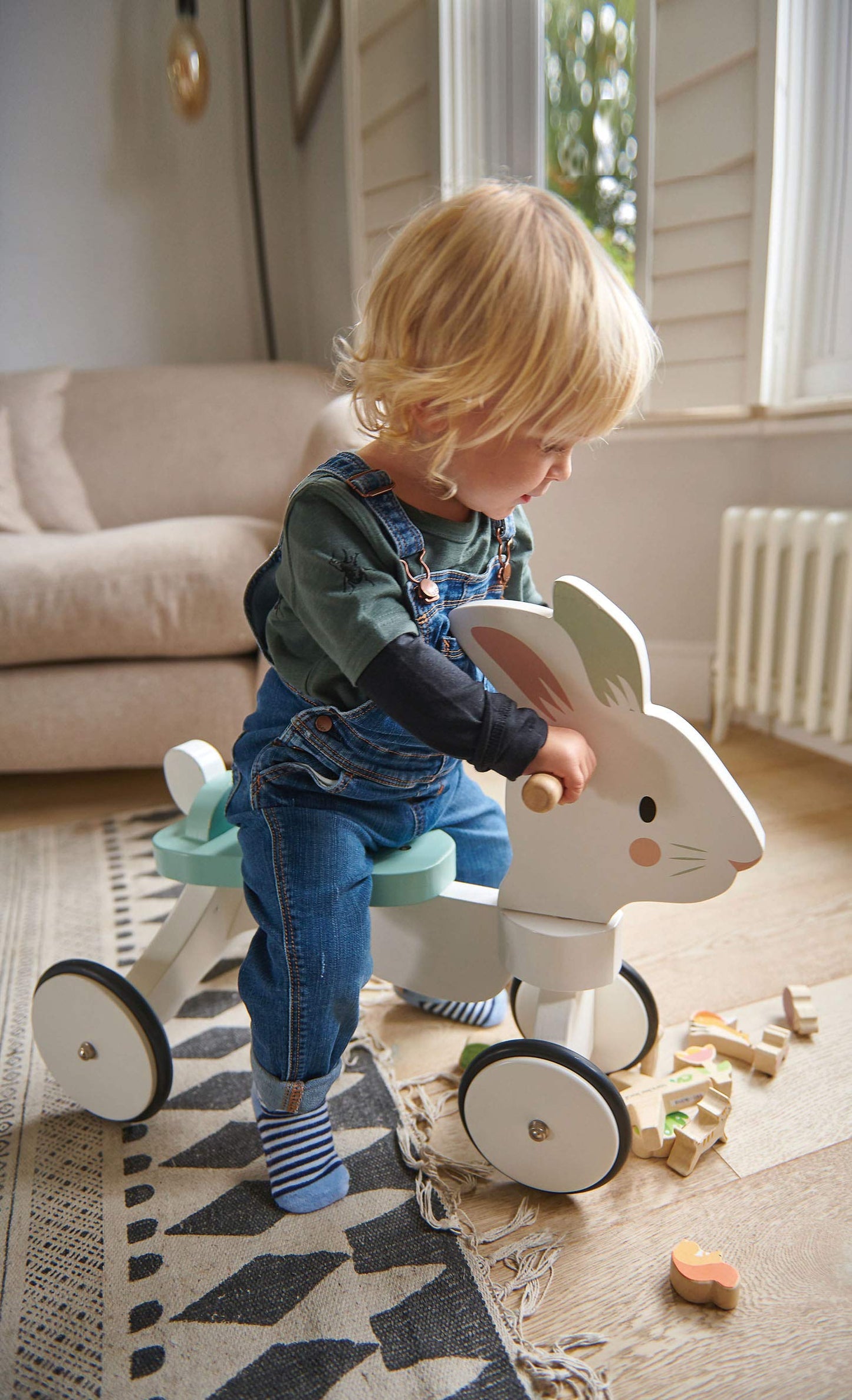 Tender Leaf Toys - Running Rabbit Ride On - Wooden Four Wheeled Push Balance Rabbit Themed Bike with Rubber Ring and Handle - Early Walk Development and Muscle Strength Enhancement for Children 18M+